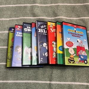Peanuts VHS Set with Colorful Character Covers - Red, Yellow, Green, Blue, Black